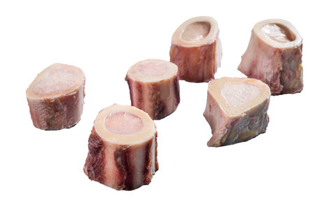 Raw calf Marrow bones on butcher table. isolated on white backgroundの写真素材