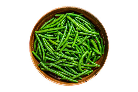 Cooked green beans in a wooden plate. isolated on white background