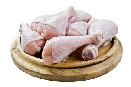 Raw chicken legs. isolated on white backgroundの写真素材