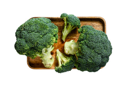 Fresh broccoli in a wooden bowl. isolated on white backgroundの写真素材