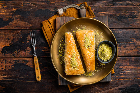 Carrot Slice Baklava, Turkish Havuc Dilim Baklava with pistachio. wooden background. top view.の写真素材