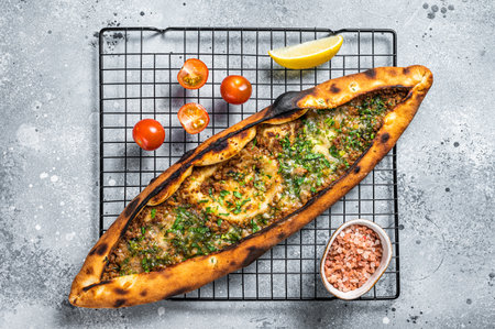 Turkish pide, traditional pie with beef meat and vegetables. white background. top view.の写真素材