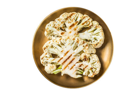 Grilled cauliflower steak with thyme and spices in a plate. isolated on white backgroundの写真素材