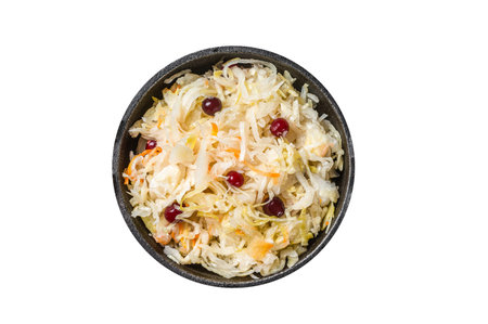 Sauerkraut in a skillet with black pepper and cranberry, Fermented cabbage. Isolated on white backgroundの写真素材