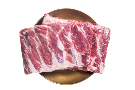 Rack of raw pork spare ribs. Isolated on white backgroundの写真素材