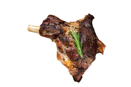 Baked lamb mutton leg meat on a wooden cutting board. High quality Isolate, white background