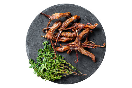 Cooked Spicy fried duck tongue. Isolated on white backgroundの写真素材