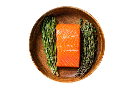 Healthy food - fresh salmon fillet steak with herbs. Isolated, white background. Top view