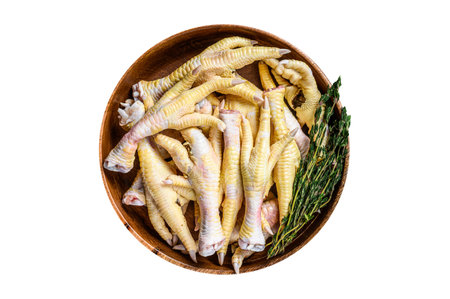 Raw fresh Chicken feet in wooden plate. wooden background. Top view.の写真素材