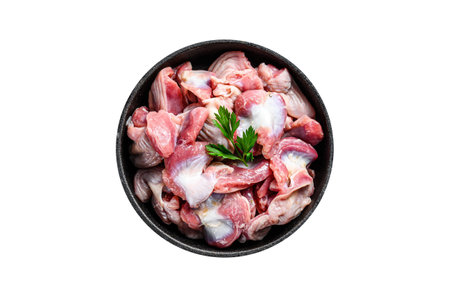 Raw uncooked chicken gizzards, stomach in a pan. Isolated, white background