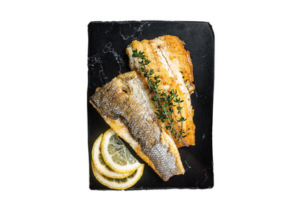 Roast sea bass fillet with lemon and thyme, seabass fish. Isolated, white background