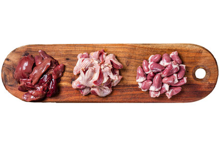 Raw chicken offals, liver, hearts, gizzards Stomach meat set. Isolated, white background