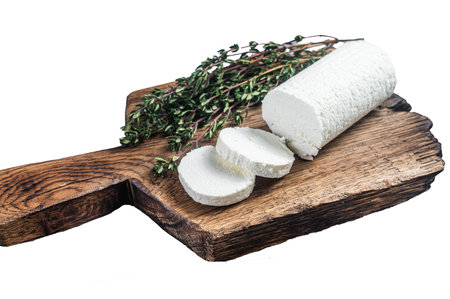 Fresh goat soft cheese with thyme. Isolated, white backgroundの写真素材