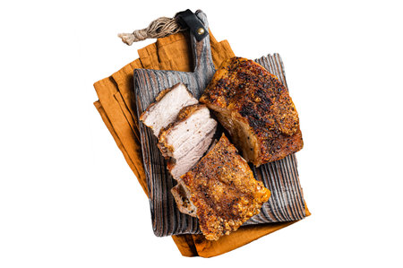 Roasted Pork belly bacon with crust on a wooden board. Isolated, white backgroundの写真素材