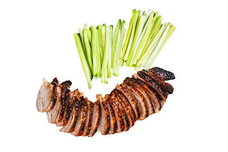 Sliced Peking Duck served with cucumber, green onion, and wheaten chinese pancakes on a meat cleaver. Isolated, white backgroundの写真素材