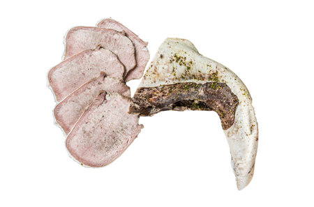 Sliced boiled beef tongue with herbs. Isolated on white backgroundの写真素材