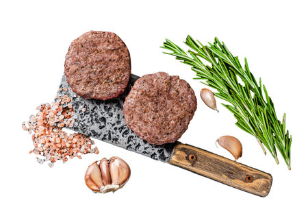 Butcher beef meat steak patties on a cleaver. Isolated on white background, top viewの写真素材