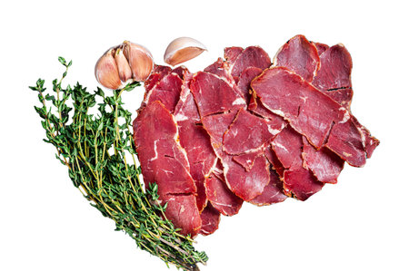Sliced Pastrami roasted beef meat with herbs. Isolated on white background, top view.の写真素材