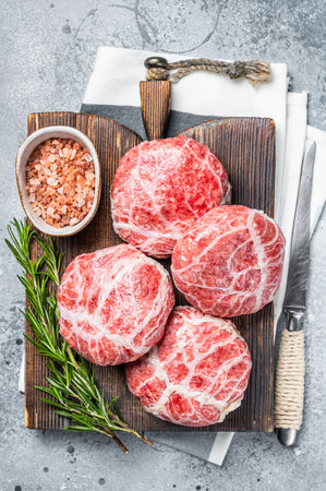 Raw Caul Fat Meatballs burger cutlets, fresh meat. Gray background. Top view.の写真素材