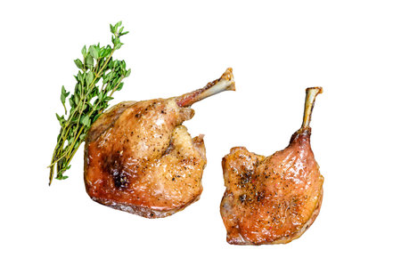 Roasted duck leg confit with cranberry sauce. Isolated on white background, Top viewの写真素材