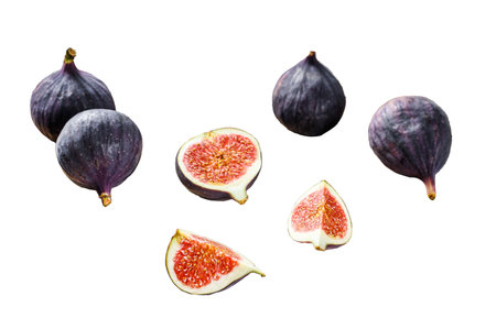 Ripe purple figs on a chopping board. Isolated on white background. Top viewの写真素材