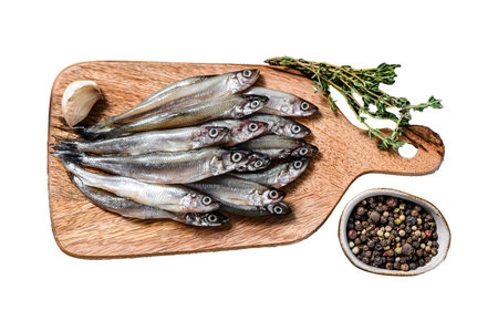 Fresh raw sea small fish smelt. Isolated on white background. Top viewの写真素材