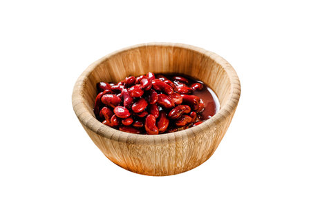 Red canned beans in a bamboo bowl. Isolated on white background. Top viewの写真素材