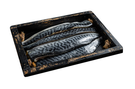 Ready for cooking sliced raw mackerel fillet fish in a wooden box with herbs. Isolated on white...