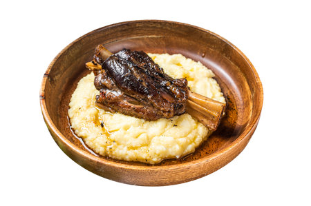 Braised lamb shank on the mashed potato in a bowl. Isolated on white background. Top viewの写真素材