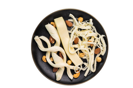 Assortiment of Traditional Caucasian Chechil white cheese isolated on white background
