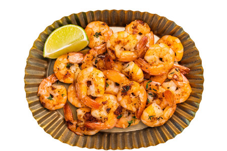 Roasted Shrimps Prawns in a metal plate isolated on white backgroundの写真素材