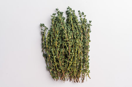 Fresh thyme sprigs bunch isolated on white background. top view.の写真素材