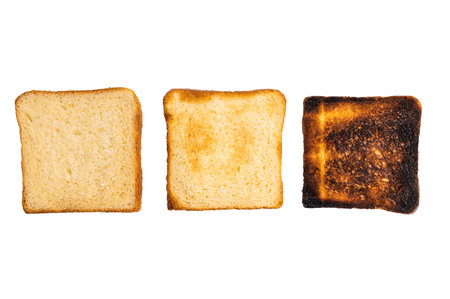 Set of slices of toasted bread, different colors, isolated on white background. top view.の写真素材
