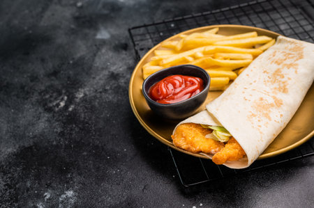Doner kebab with shrimps, prawns, salad and French fries. black background. top view.の写真素材
