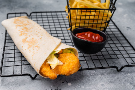 Seafood Doner kebab with shrimps, prawns, salad and French fries. gray background. top view.の写真素材