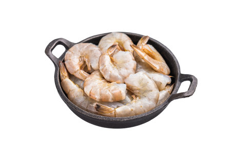 Raw headless white shrimps prawns in a skillet isolated on white backgroundの写真素材