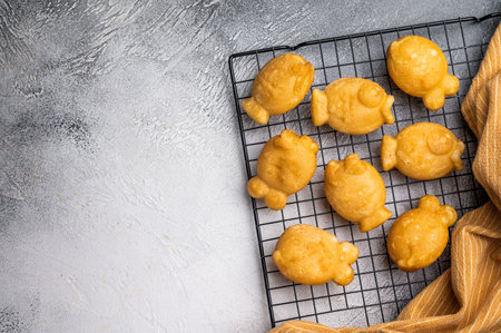 Korean pancake Bungeoppang, Fish shaped Waffle with sweet red bean filling. white background. top view.の写真素材