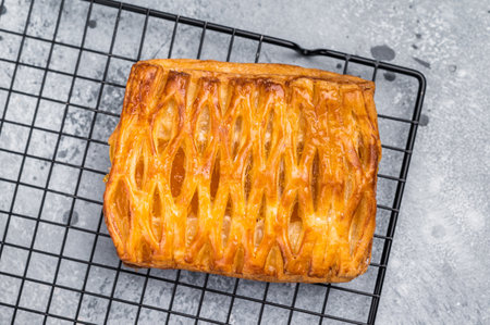 Danish pastry with a lemon jam, Puff pastry. gray background. top view.