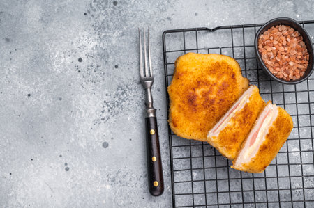 Fried Chicken cordon bleu cutlet with cheese and ham in breadcrumbs. gray background. top view.の写真素材