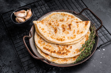 Aloo Paratha Indian Potato stuffed Flatbread. black background. top view.の写真素材