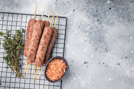 BBQ Roasted beef and lamb meat kebabs sausages, kofta kebab. gray background. top view.の写真素材