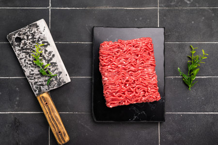 Raw beef and pork mince meat, mincemeat, on black backgroundの写真素材