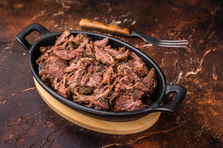 Slow Cooked Pulled Beef, Traditional meat rubbed with spices and smoked. brown background. top view.の写真素材
