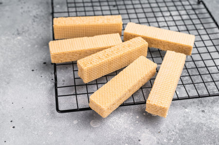 Wafer stick biscuits on a rack. gray background. top view.の写真素材