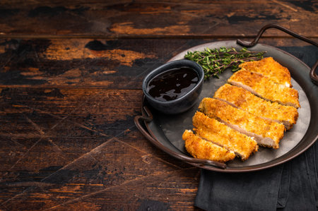 Katsu Golden fried cutlet. This Japanese favorite brings comfort and flavor to any table. wooden background. top view.の写真素材