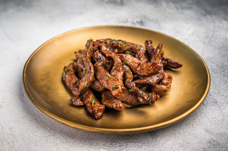 Asian food Teriyaki beef meat on a plate on gray background. top view.の写真素材