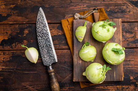 Cabbage kohlrabi on wooden board, raw Organic Vegetable. wooden background. top view.の写真素材