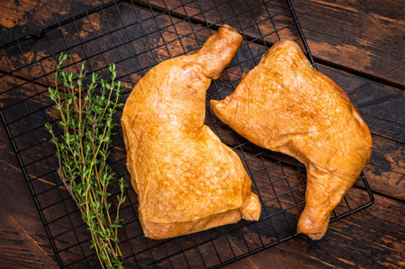 Hot smoked chicken leg, poultry meat meal. wooden background. top view.の写真素材