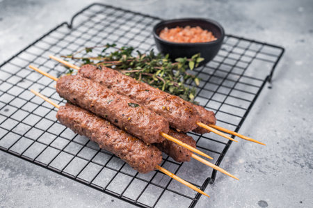 BBQ Roasted beef and lamb meat kebabs sausages, kofta kebab. grey background. top view.の写真素材