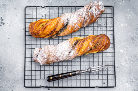 Danish pastry with Pistachios and chocolate, Puff pastry. grey background. top view.